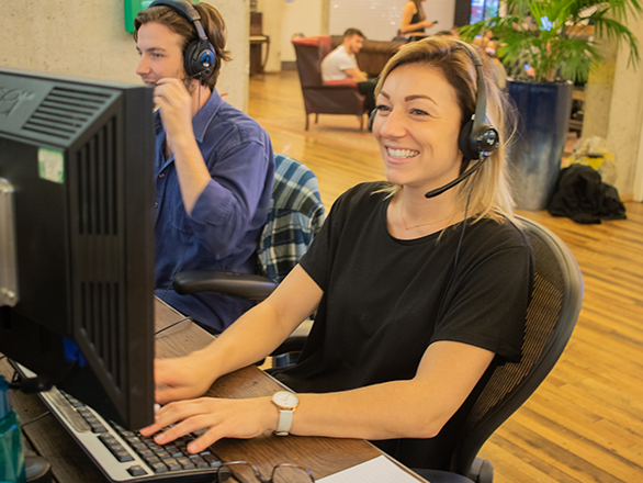 An Amigo employee at her computer